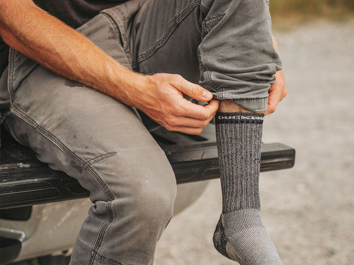 A man wearing a merino wool sock.