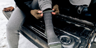 A person wearing merino wool socks in the winter.