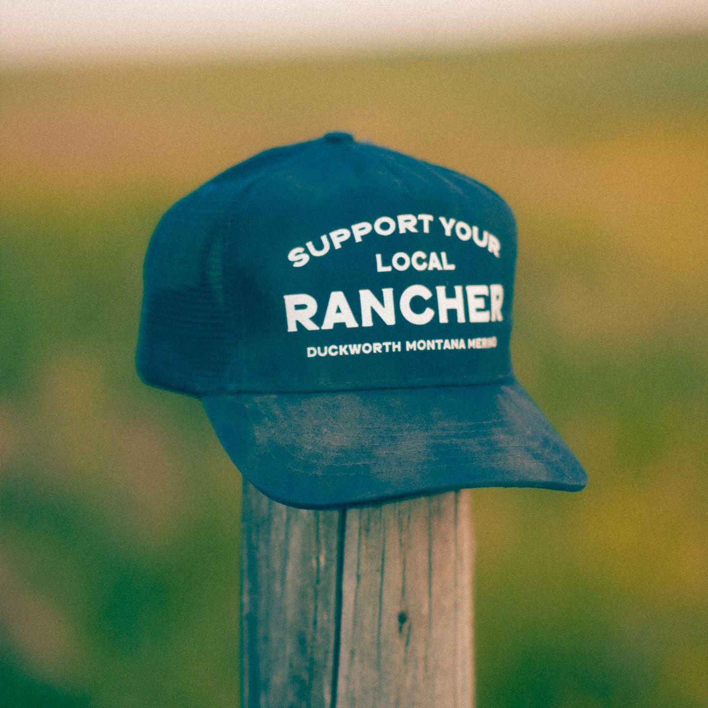 A blue American made trucker hat that supports Montana and ranching. 