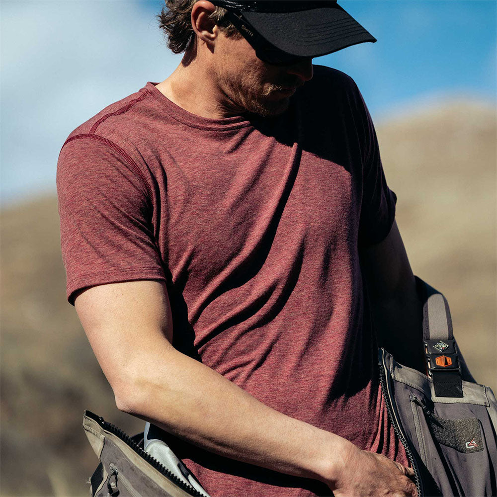 A fisherman wearing an American made Duckworth merino wool light weight tee shirt.