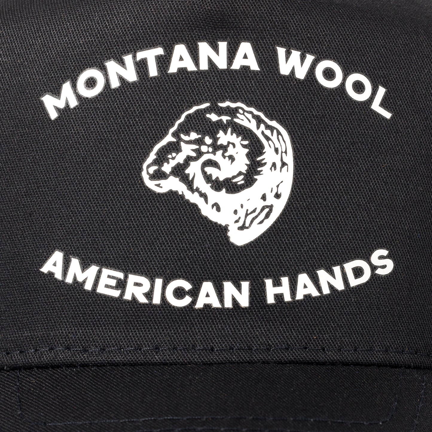 A black American made baseball hat with a Montana logo. 