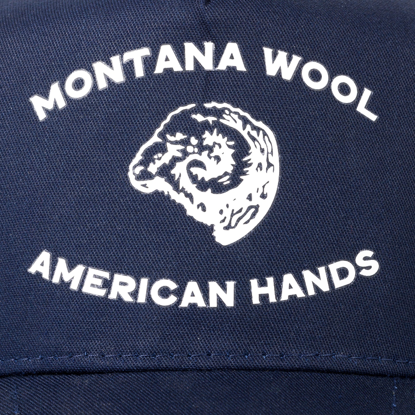 A blue American made baseball hat with a Montana logo. 