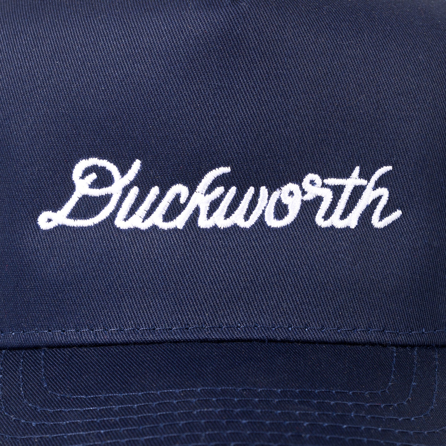 A blue American made baseball hat with a Duckworth logo. 