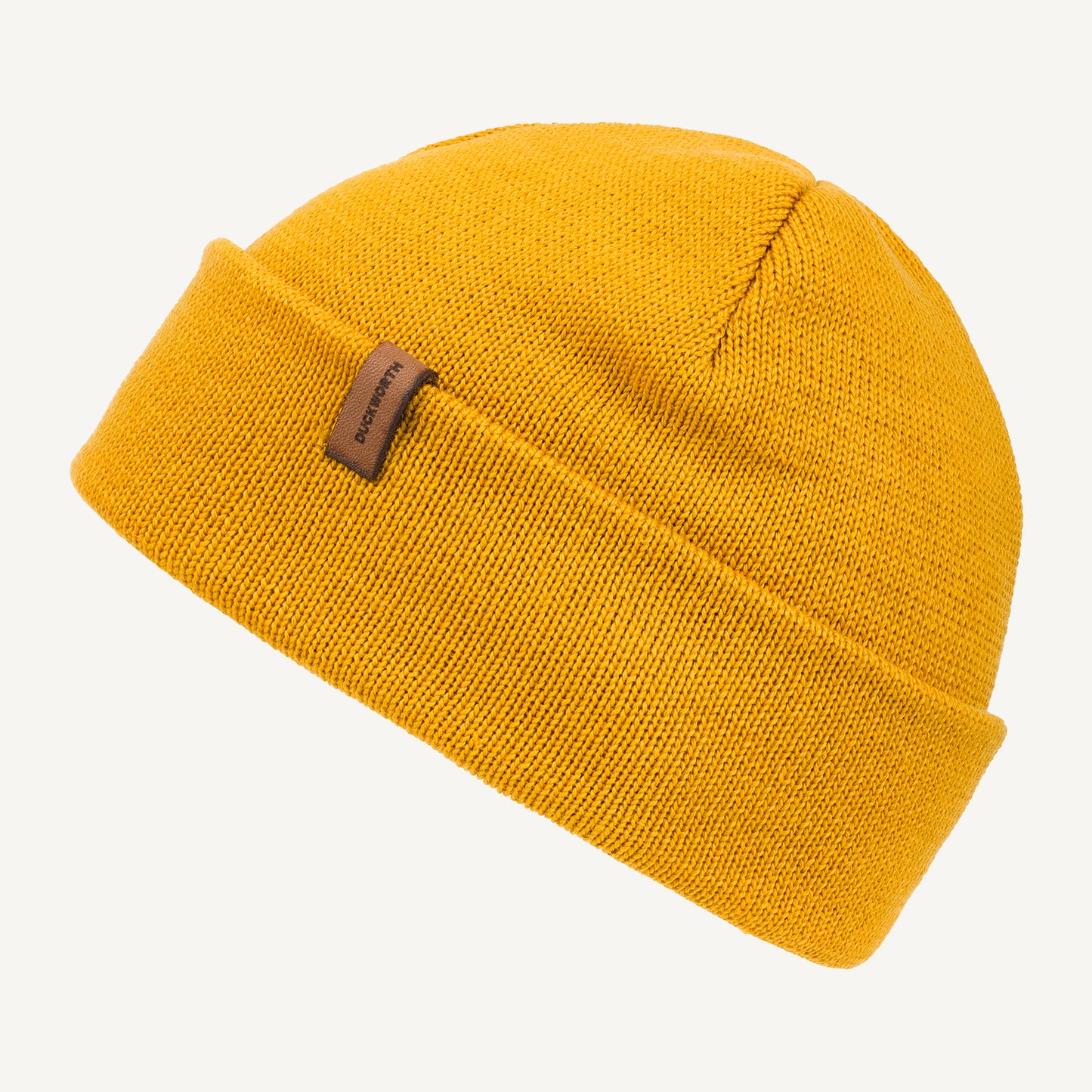 Yellow made in America merino wool knit hat with leather patch. 