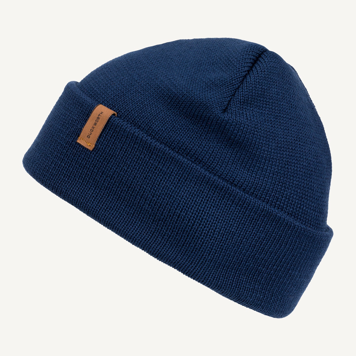 Navy made in America merino wool knit hat with leather patch. 