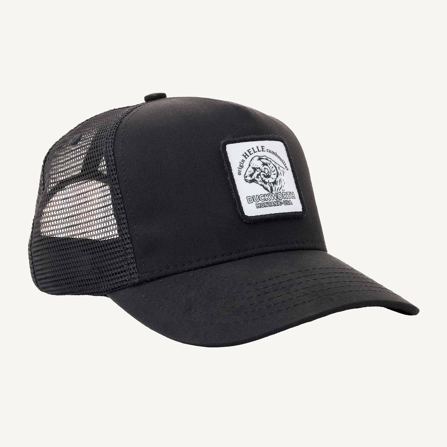 A black American made trucker hat with a Duckworth patch on it.