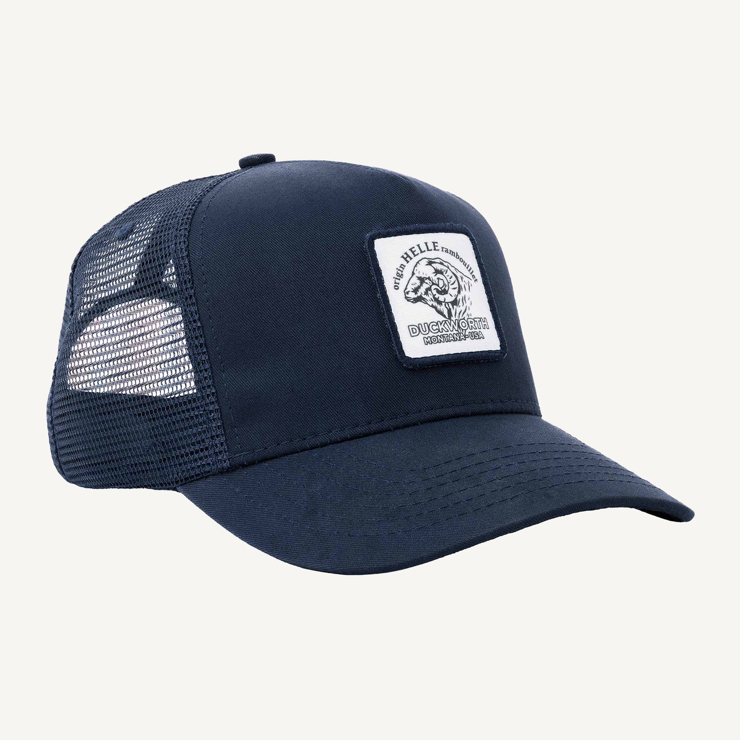 A blue American made trucker hat with a Duckworth patch on it.