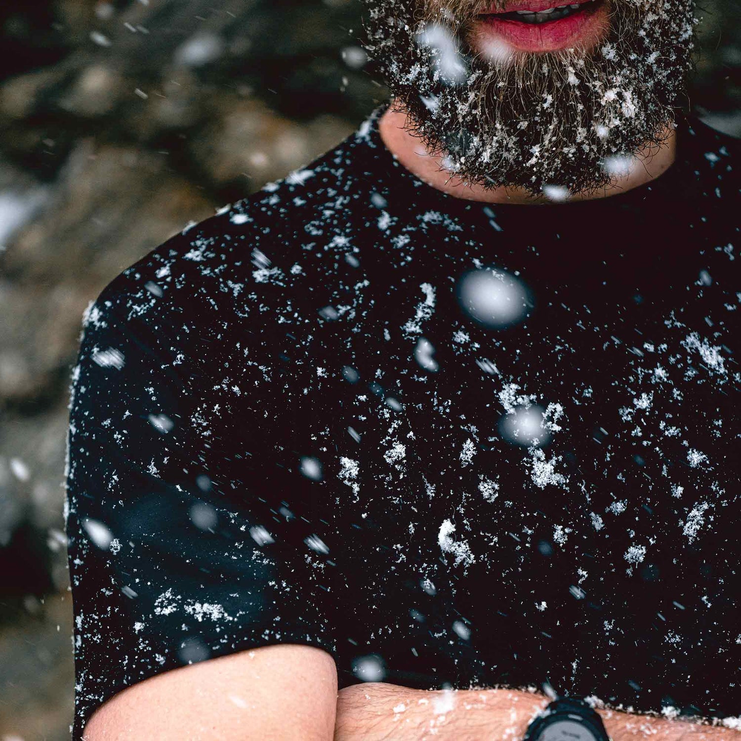 A man wearing a black American made Duckworth merino wool tee shirt. 