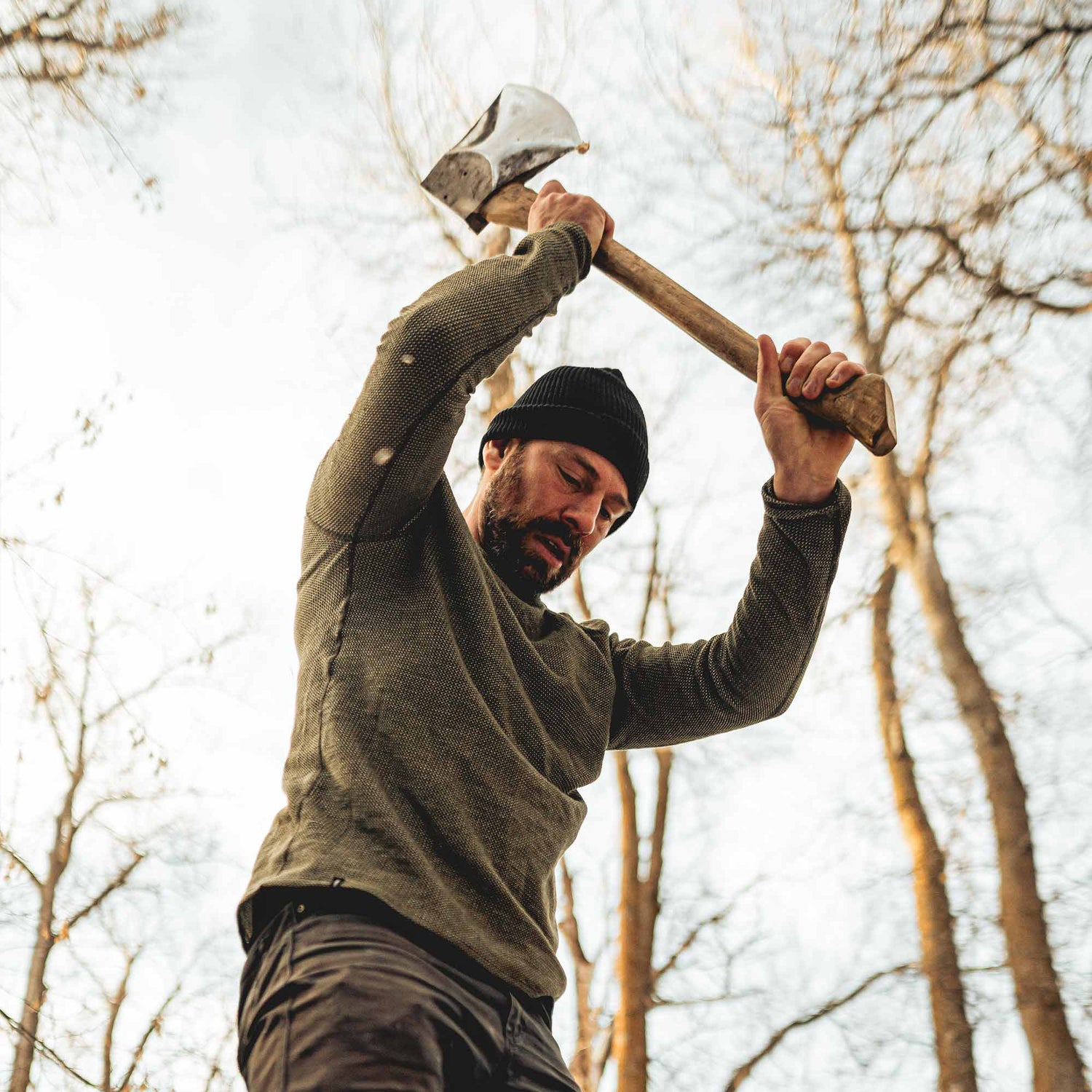 A man wearing a green American made Duckworth merino wool waffle knit long sleeve. 